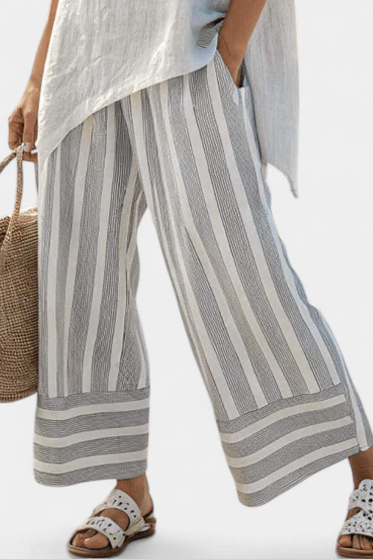Talvora | Elegant asymmetrisk bluse og striped bukser