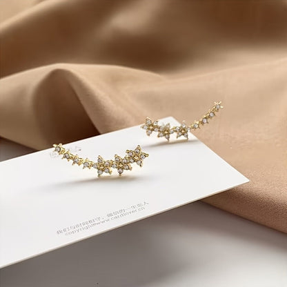 BRINCOS DOURADOS FLORAIS COM CRISTAIS RHINESTONE