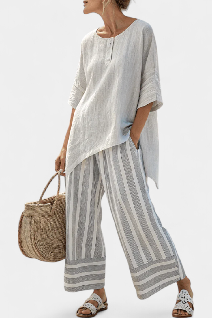 Talvora | Elegant asymmetrisk bluse og striped bukser