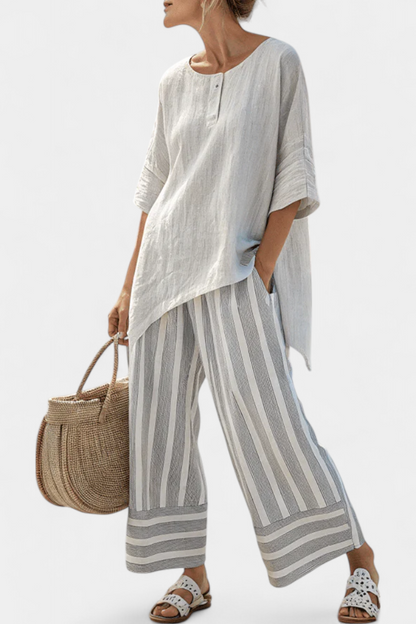 Talvora | Elegant asymmetrisk bluse og striped bukser