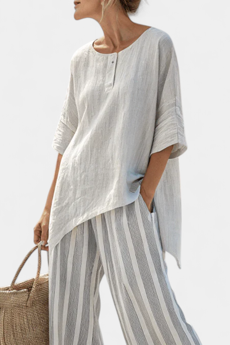 Talvora | Elegant asymmetrisk bluse og striped bukser