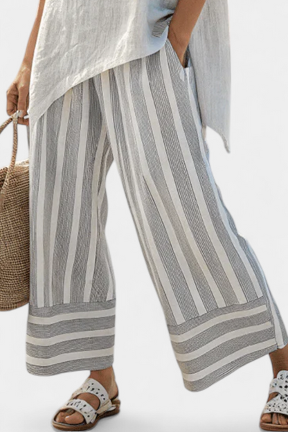 Talvora | Elegant asymmetrisk bluse og striped bukser